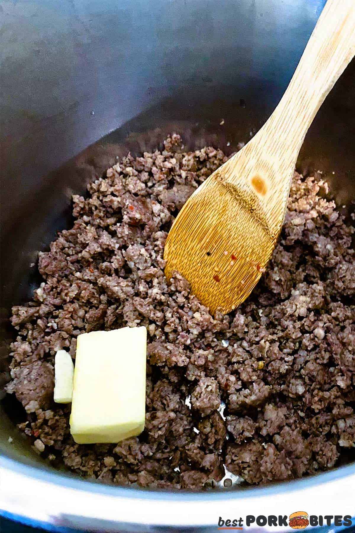 butter added to the pot of browned ground pork
