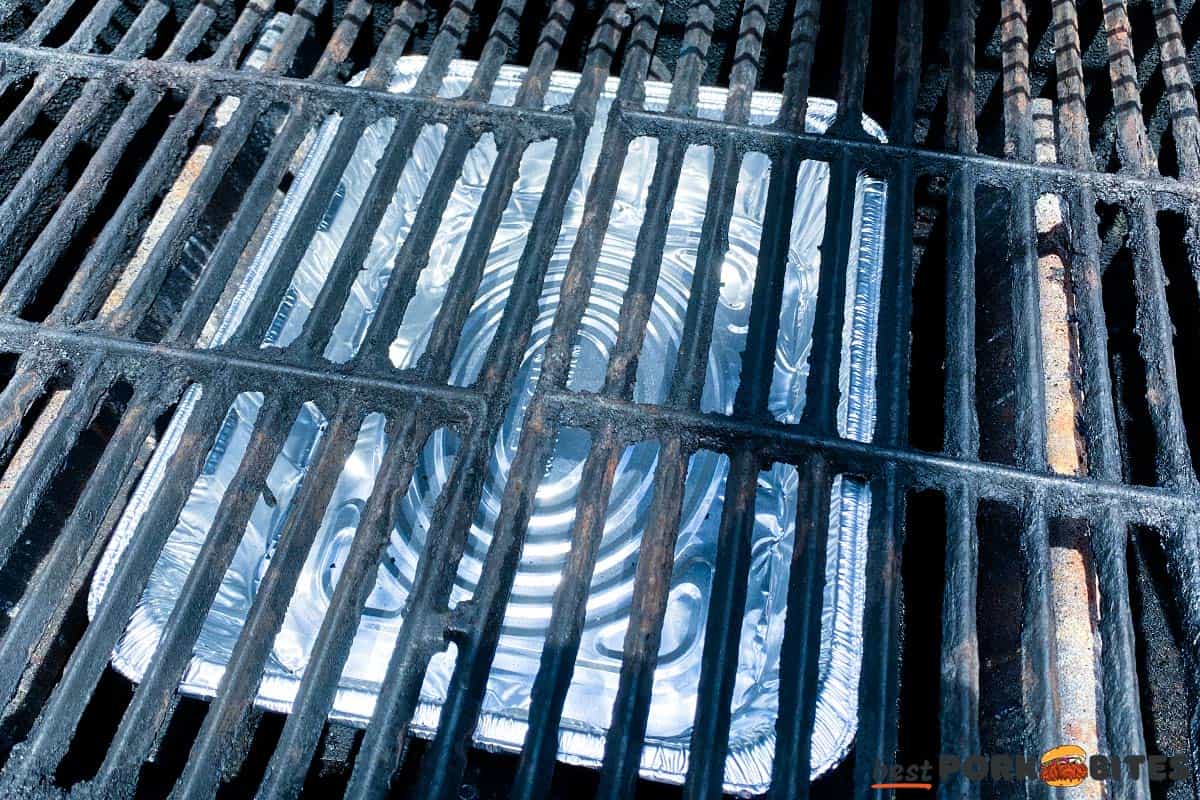 aluminum pan in the center of a grill