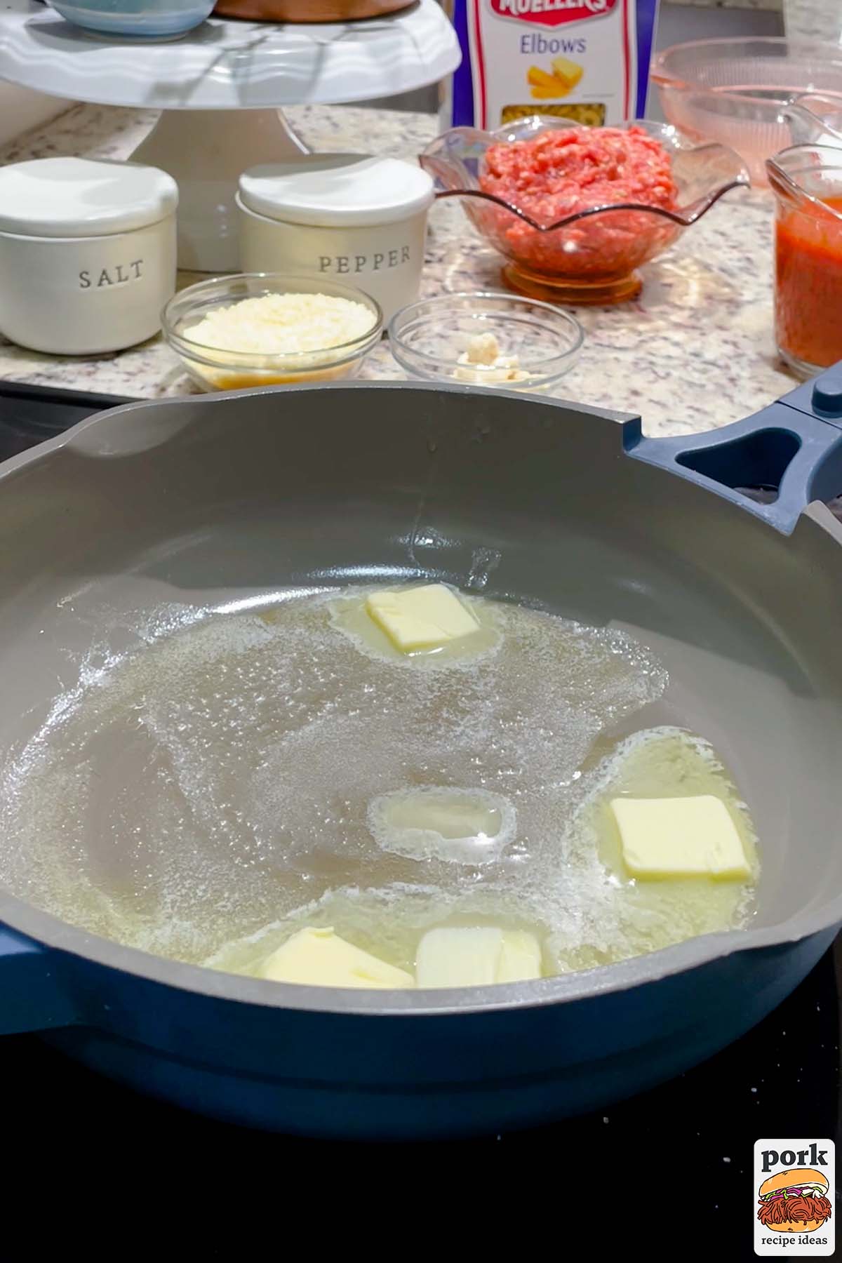 melting butter in a blue pan