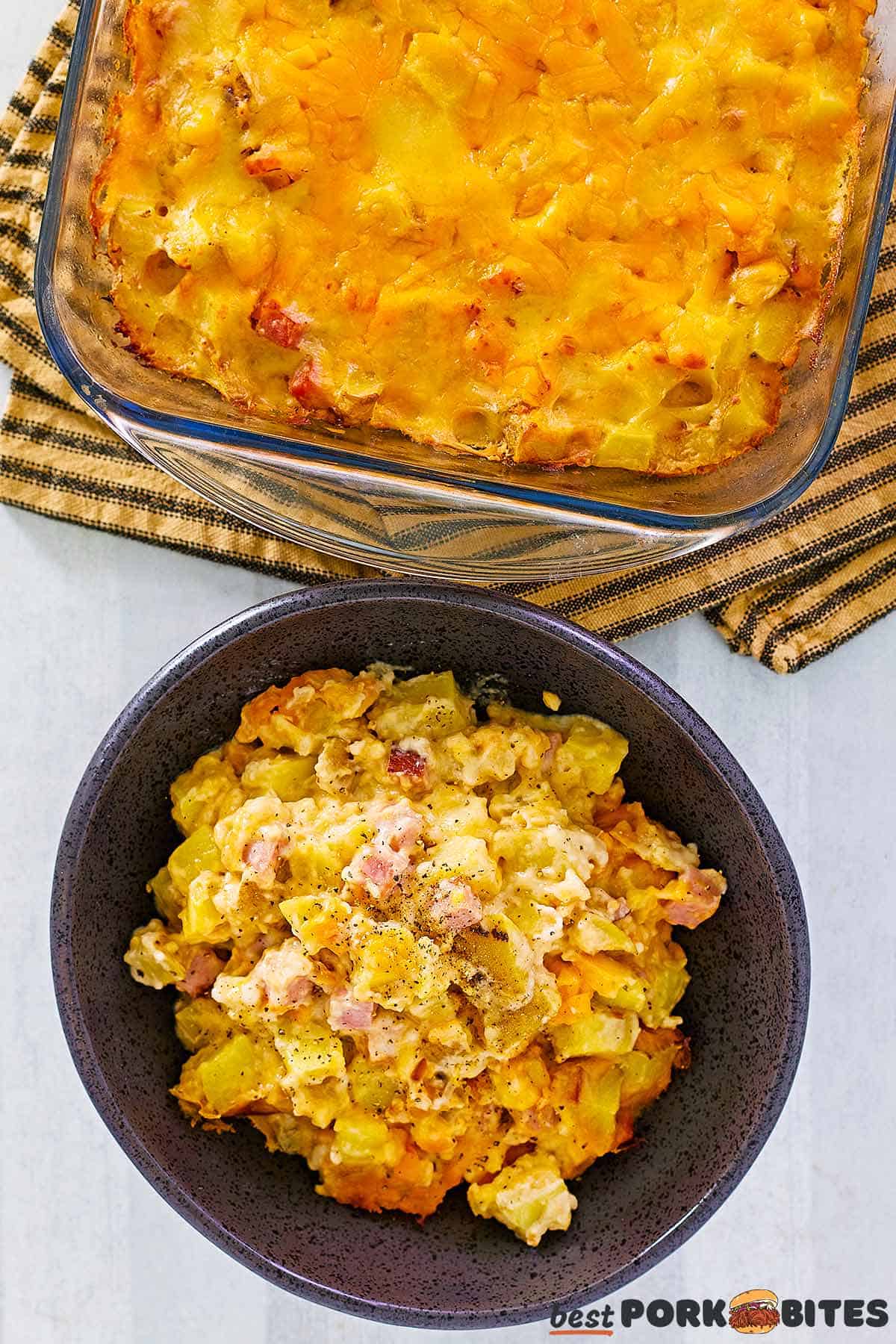 a bowl of complete ham casserole next to a baking dish full of casserole