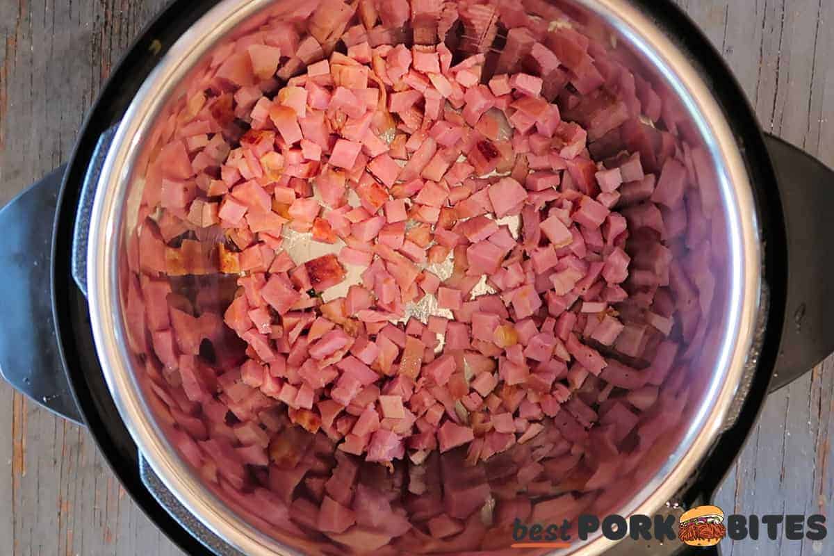 ham being sauteed in an instant pot