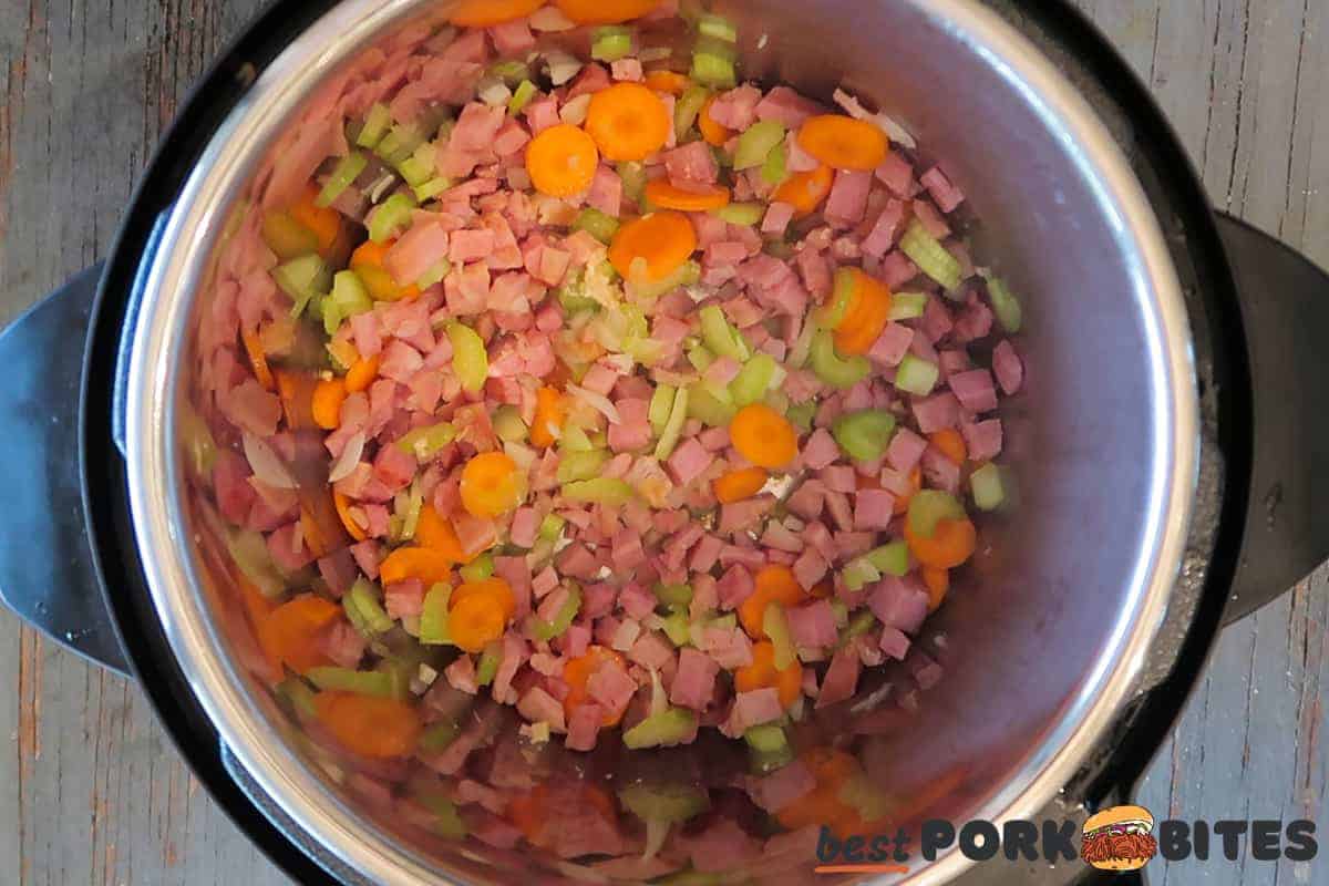 ham and vegetables sauteeing in an instant pot