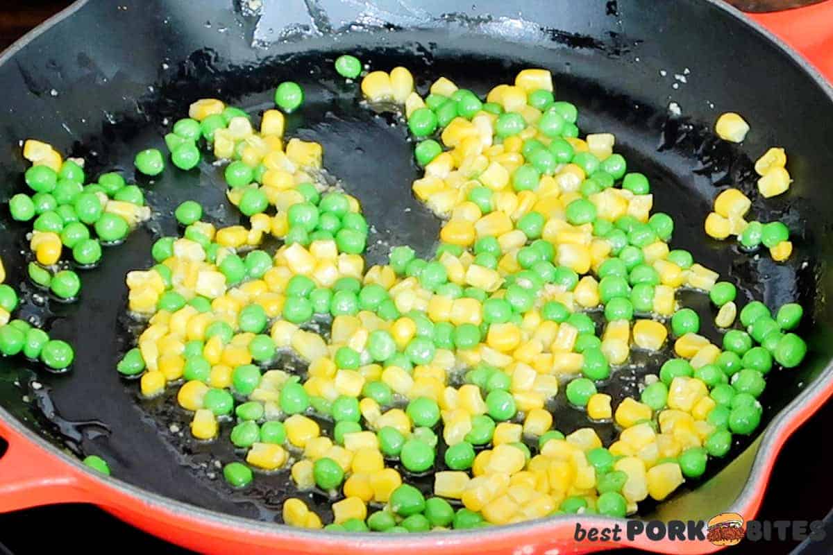 frozen peas and corn in a skillet