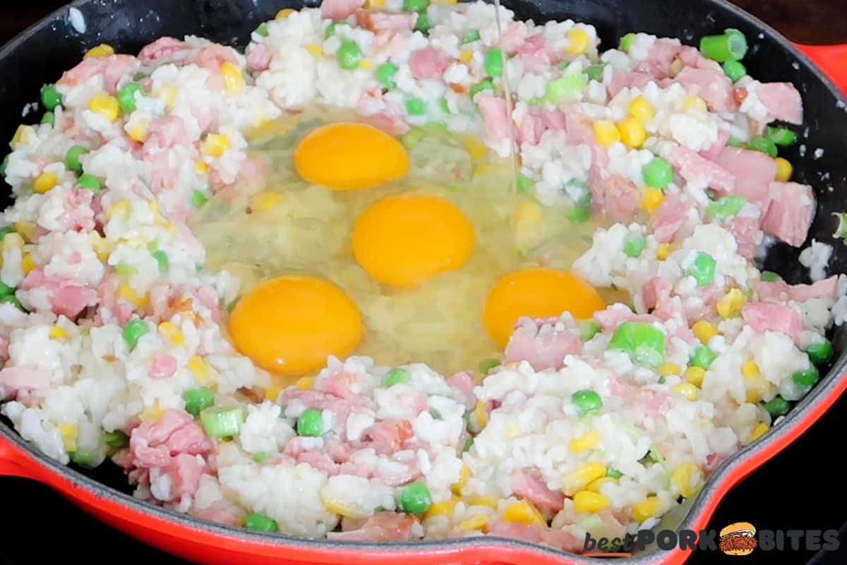 adding eggs to ham fried rice