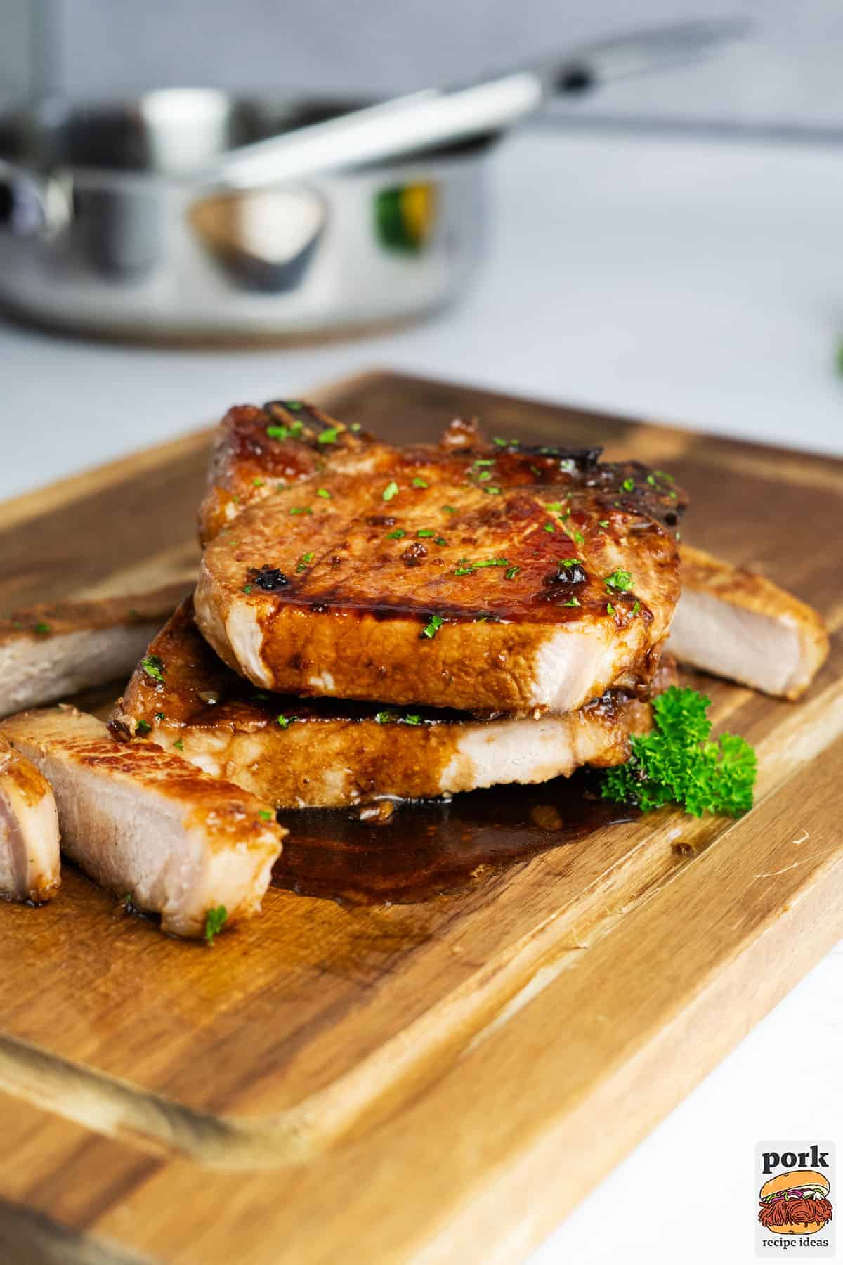 honey garlic pork chops on a cutting board