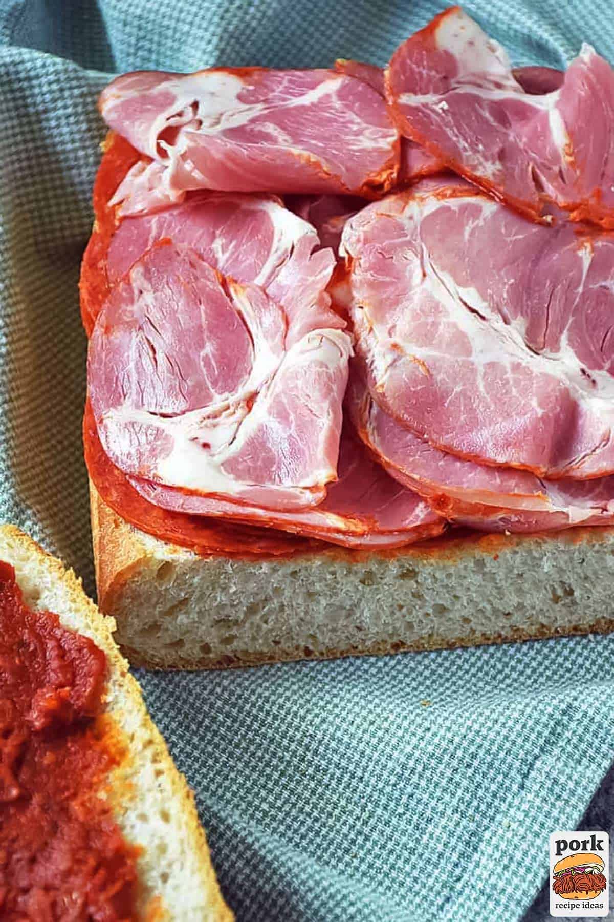 the ham and pepperoni layered on bread