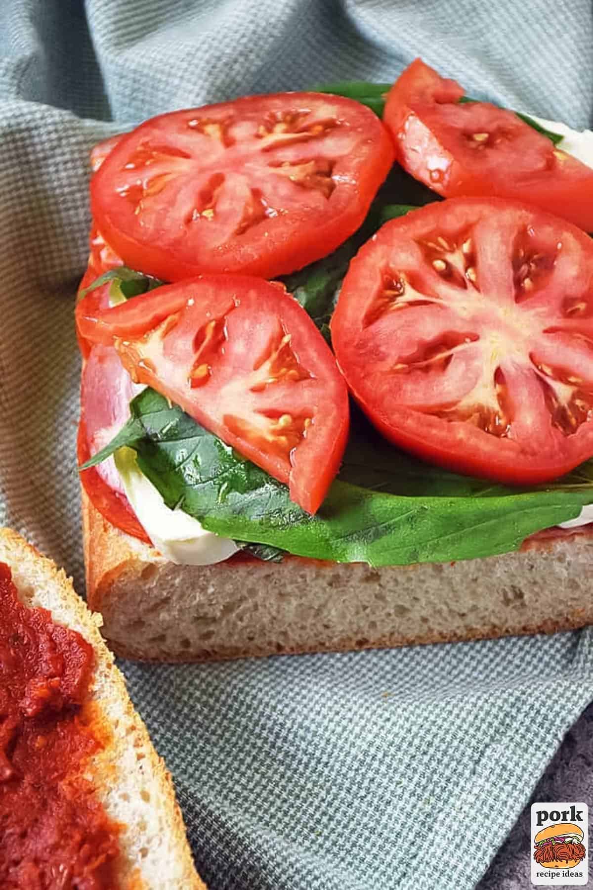 tomato, basil and mozzarella added to the sandwich