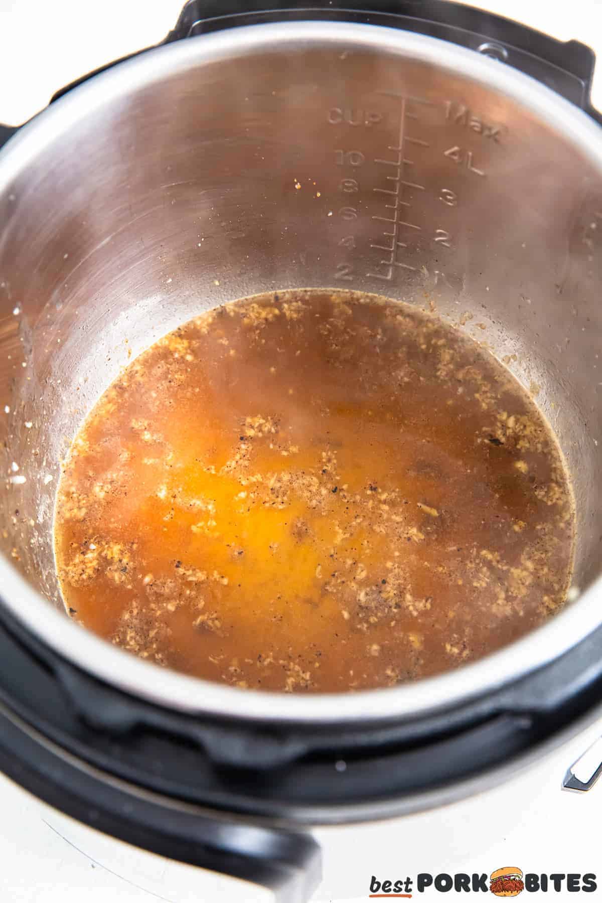 broth added to the instant pot pan to make gravy