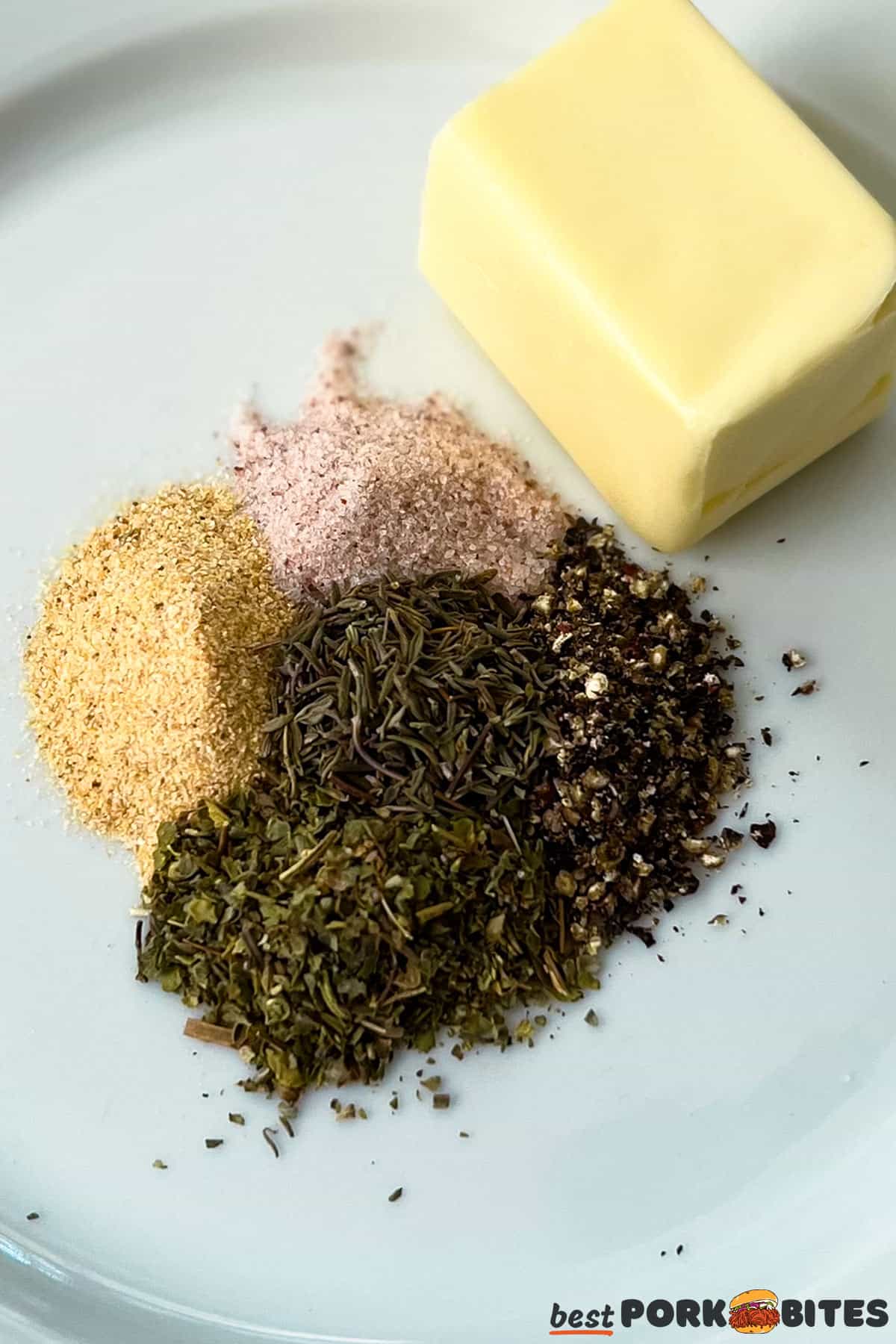 spices for pork on a plate with butter