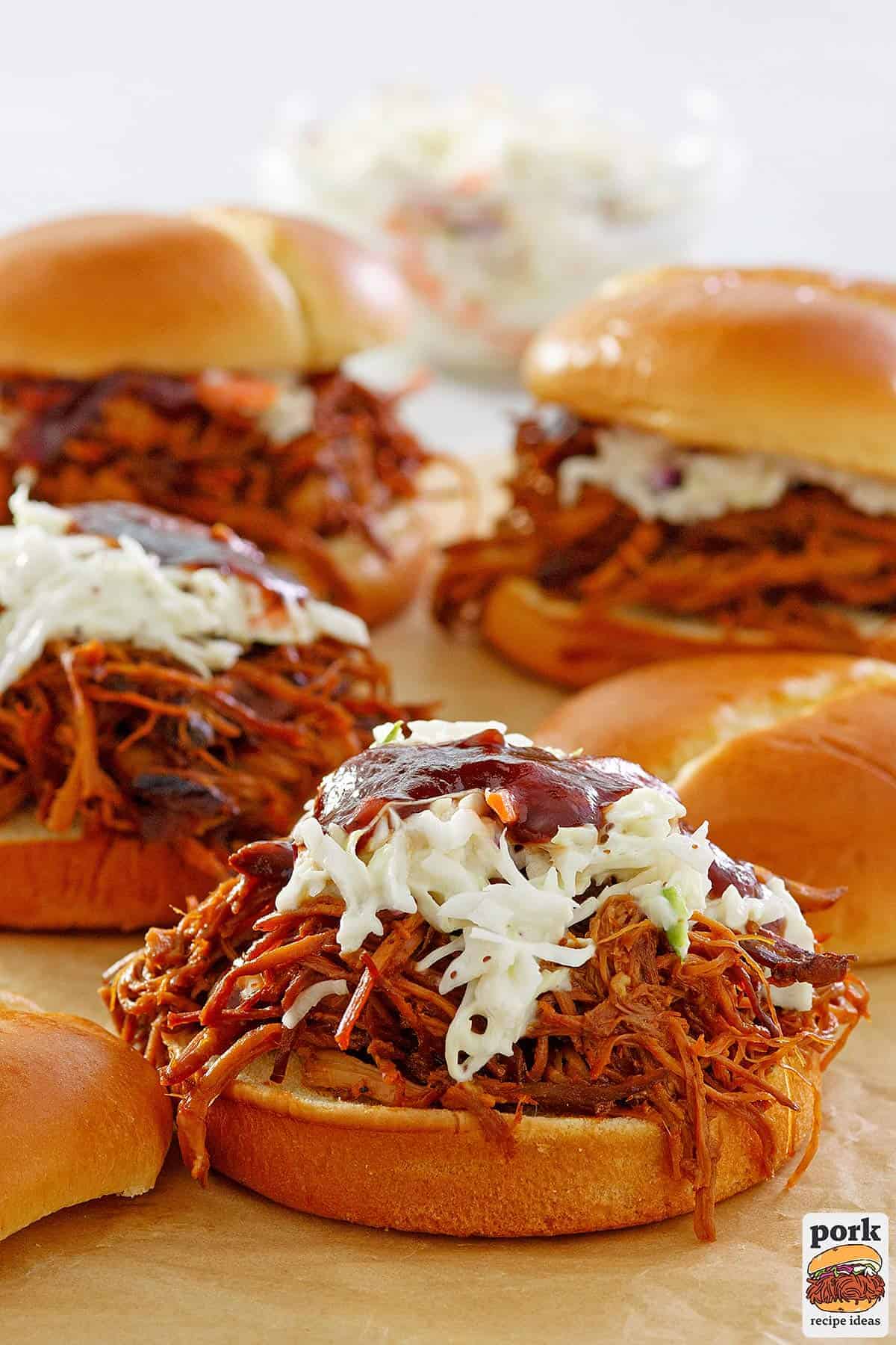 a tray of completed BBQ pulled pork sandwiches