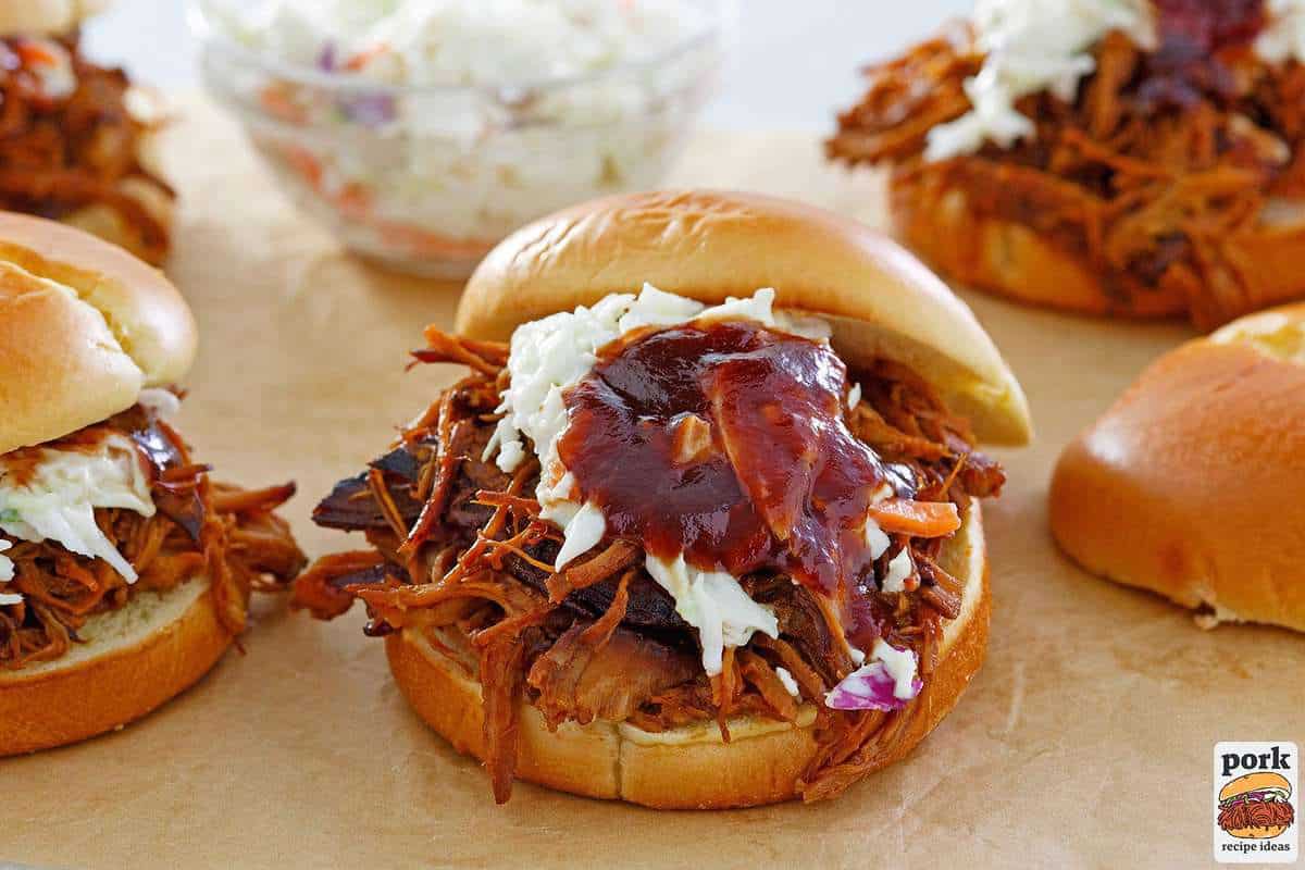 completed pulled pork sandwiches with coleslaw and bbq