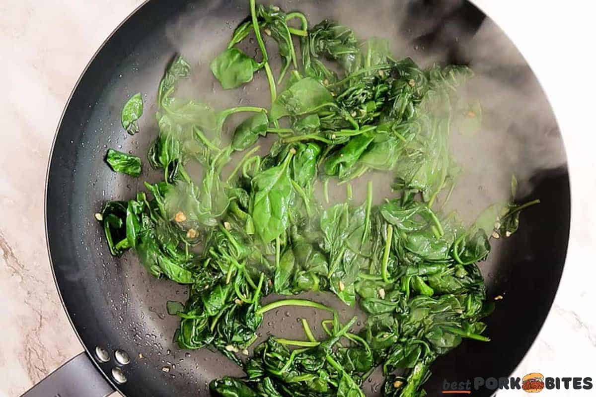 softened sauteed spinach in a pan