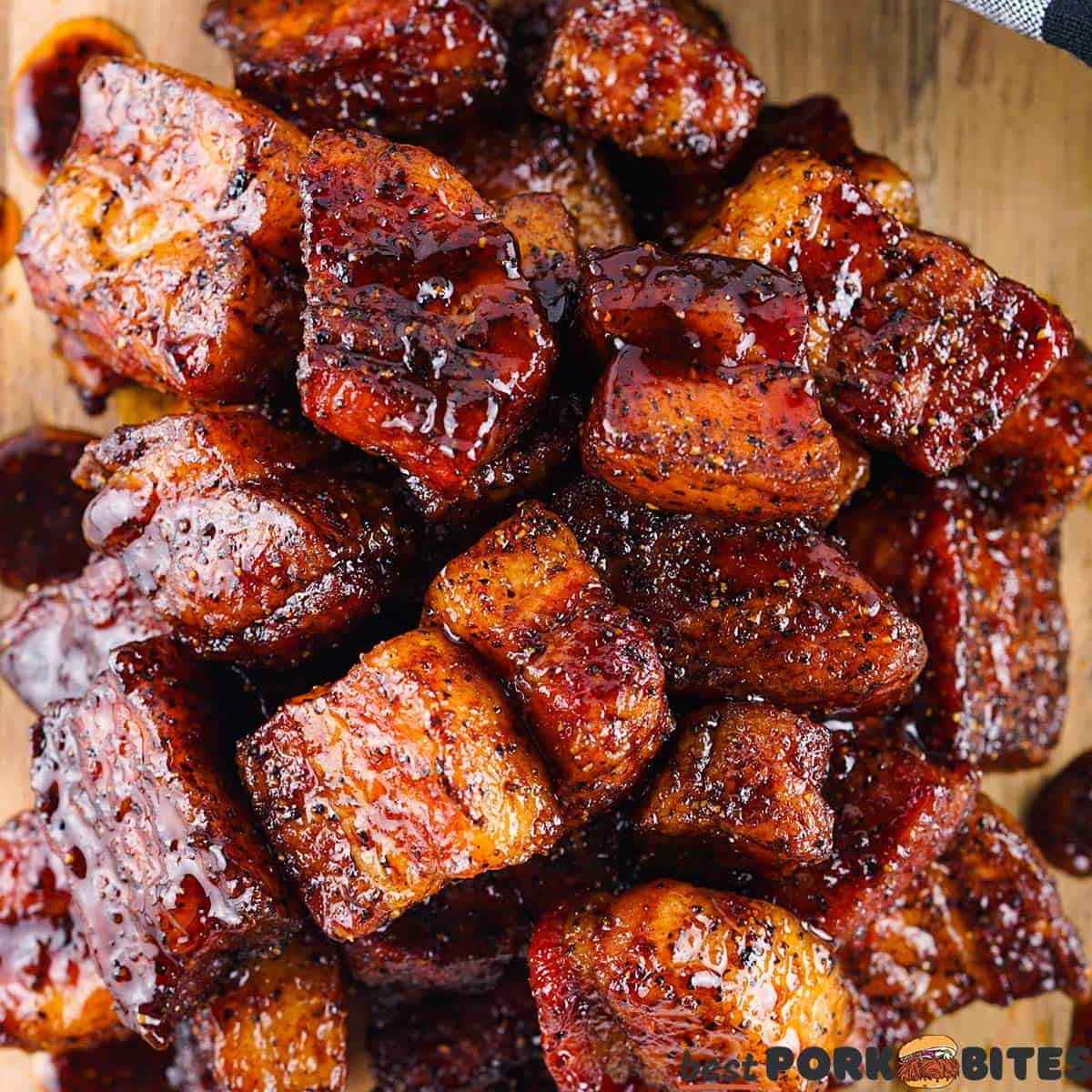 a closeup of completed pork belly burnt ends with sauce
