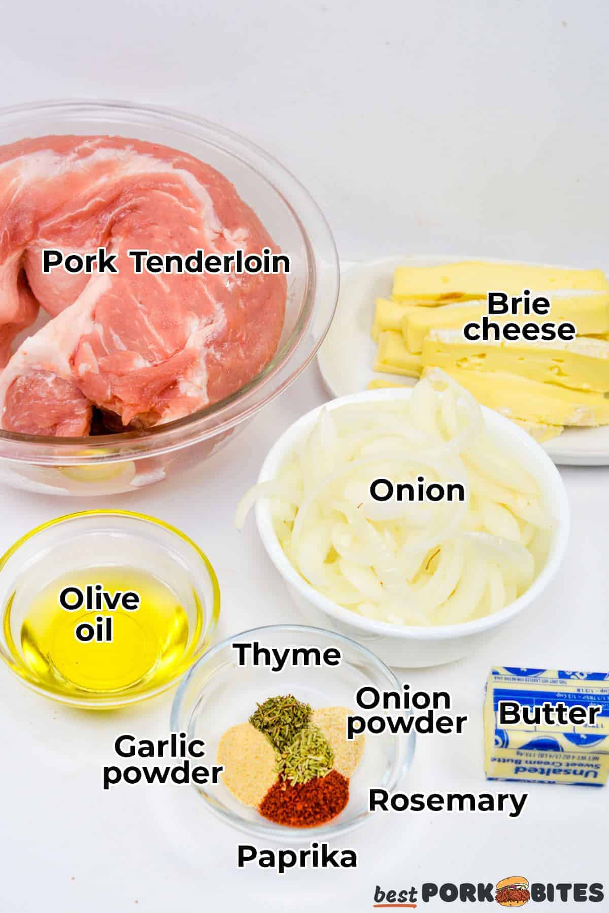 all the ingredients for stuffed pork tenderloin in separate bowls on a white counter